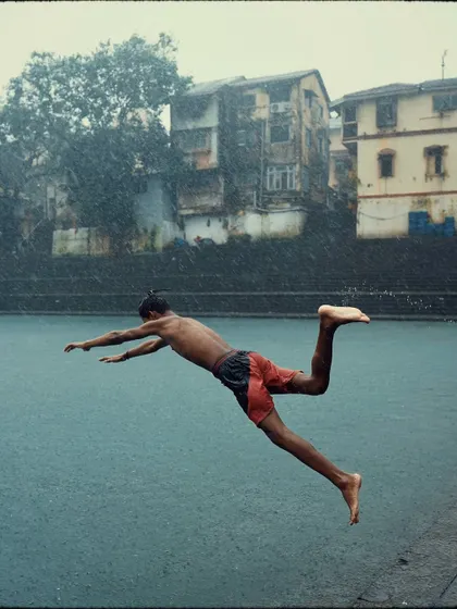 Beyond the big events, I find stories in quiet corners. This shot from the historic Banganga Tank during the monsoon captures a moment of pure, uninhibited joy. It reflects my philosophy of finding beauty in the simple, everyday life of the city.
