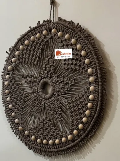 The texture and detail of this mandala wall hanging are what make it so special. It's a true piece of fiber art.
