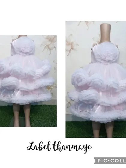 A baby pink frilled frock, perfect for a first birthday or cake smash photoshoot.