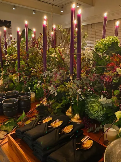 Another detail shot of the elegant place settings and lush floral decor from the intimate dinner party.