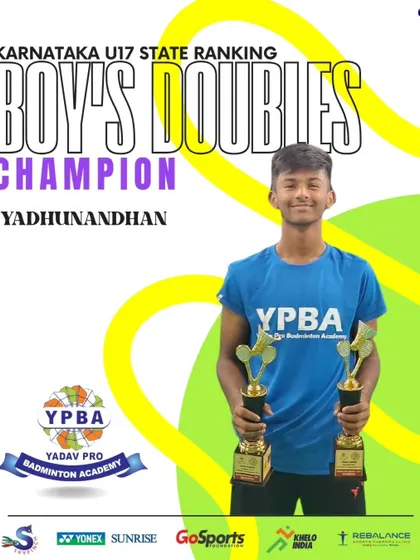 Yadunandhan, the champion in U17 Boy's Doubles at the Karnataka State Ranking tournament, showcasing his well-earned trophies.
