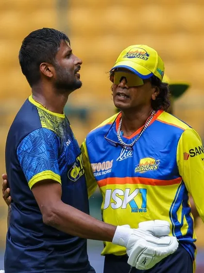 A moment of intense discussion on the field with a Mysore Warriors player. Communication is key to success in high-pressure situations.