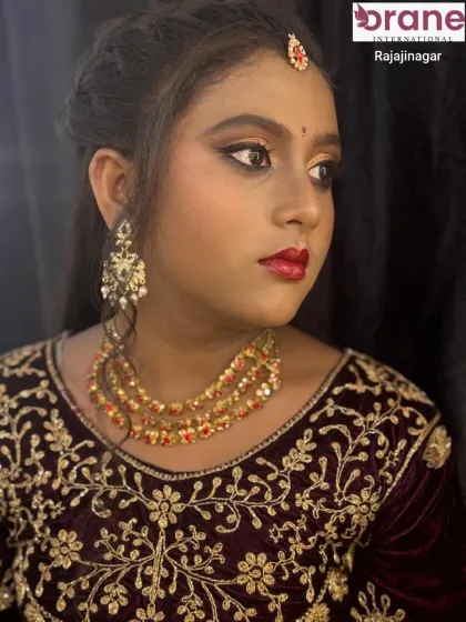 A close-up portrait that captures the elegance of the layered necklace and matching earrings.