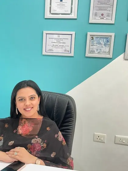 Welcome to my clinic. Behind me are the certifications that represent years of dedication to my field, but my true achievement is helping you get back to a life without pain. My goal is to be your partner in health and recovery.