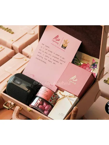 Another shot of the RCB women's team hampers, showing the thoughtful curation of gifts inside the personalized trunks.