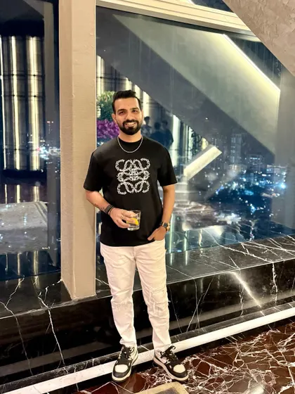 Down to earth, but still above you. A style shot showing my outfit against the city lights.