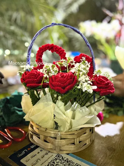Another view of our crochet rose basket, captured in our workshop. Each petal is crafted by hand to create a beautiful, everlasting floral gift.