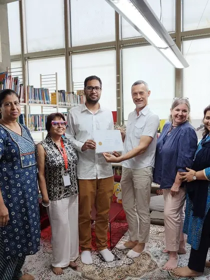 We honour a student who won 14th position in the prestigious Plume d'Or competition. This photo shows our teachers and directors celebrating the achievements of our talented students.