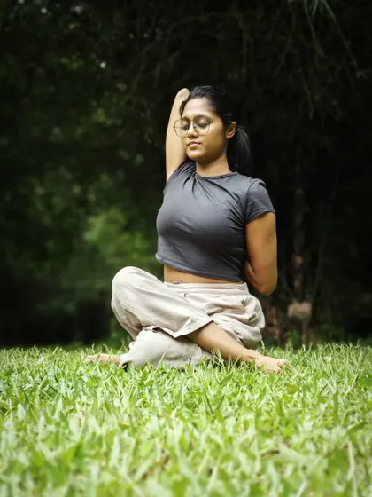 Another angle of Gomukhasana, showing the arm bind that opens up the shoulder joints. Practicing this in nature adds a sense of peace and connection.