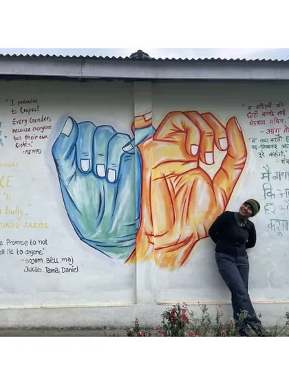 The 'Promise Mural' in Yachuli, where students wrote their promises for a better world. It was an honor to bring their words to life on this wall.