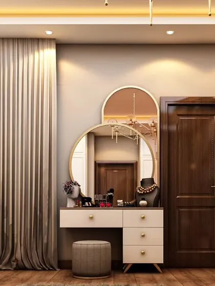 This compact dressing table nook is both elegant and functional. The design uses a combination of round and arched mirrors to create visual interest, providing a dedicated and well-lit space for getting ready.