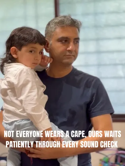 Not all heroes wear capes. Our co-founder Vivek waits patiently with a young performer during a sound check, showing the care and support that defines our team.