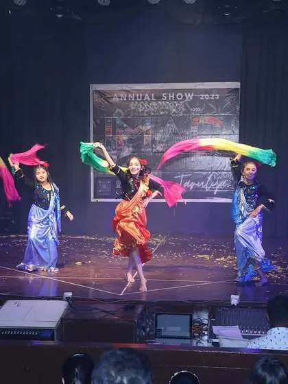 The stage is a riot of color as dancers use rainbow props in this beautiful fusion piece.