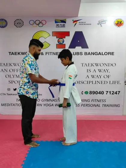 Tying a blue belt.