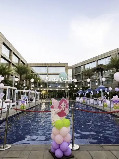 A poolside party transformation. We decorated the entire pool area with themed props and balloons, turning it into a magical fairy wonderland.