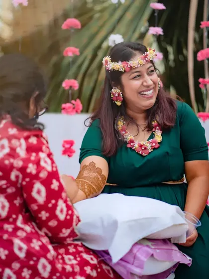A candid moment of laughter between me and the bride during the application process.