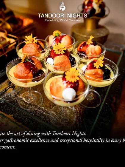 An array of delectable desserts served in elegant glassware, garnished with edible flowers. This showcases our dedication to gastronomic excellence from start to finish.