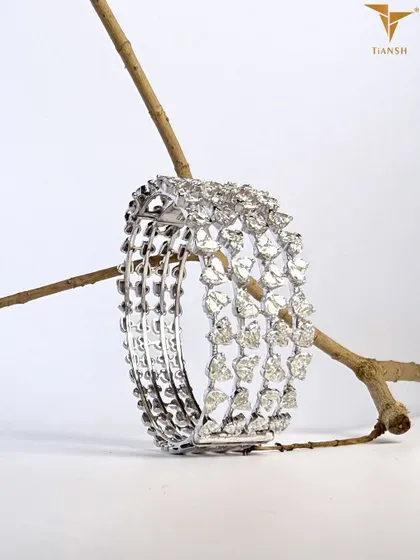 Meticulously crafted, this multi row diamond bracelet showcases expert workmanship. Each diamond is set with precision, highlighting the quality and attention to detail in every curve.