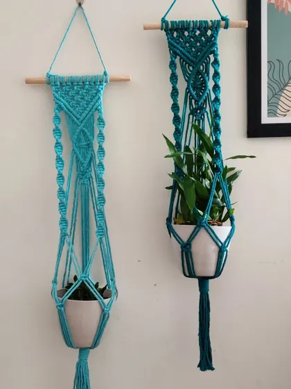 Two custom plant hangers in shades of blue, one with a tassel and one without.