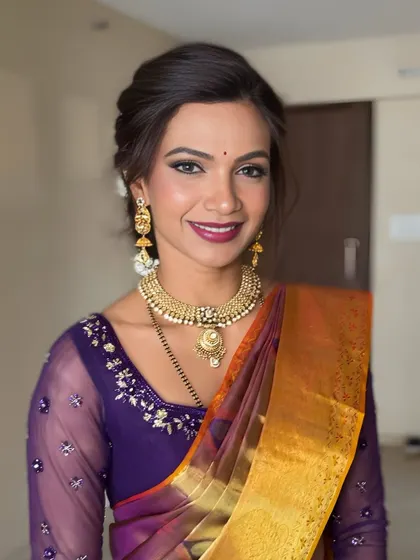 A bright and happy portrait. Her smile says it all. The makeup is designed to make her feel confident and radiant, perfect for a wedding or festive occasion.