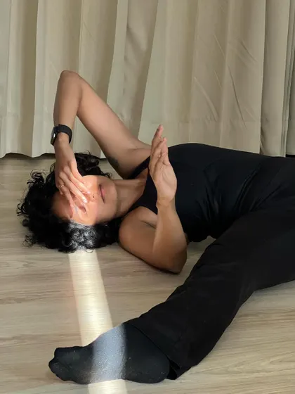 Floor work and interaction with light. This image shows the vulnerability and softness that can be expressed through dance, even in moments of quiet stillness.