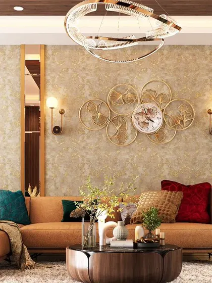 A warm and inviting living room featuring an L-shaped sectional sofa in a rich tan color. We used a combination of textured wallpaper, wood paneling, and metallic wall decor to create a layered and comfortable family space.