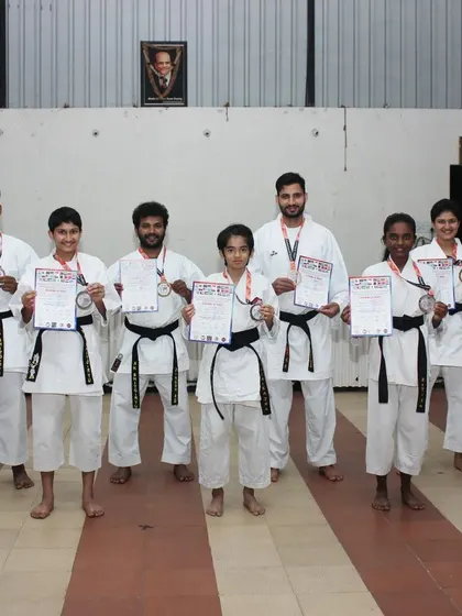Our team of karatekas, both kids and adults, show off their medals and certificates from the World Online Karate Championship. We support our students in all forms of competition.
