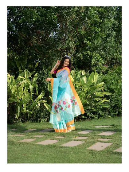 A playful, candid moment captured during our outdoor shoot. The movement and genuine smile bring the photograph to life, making the fashion feel accessible and fun.