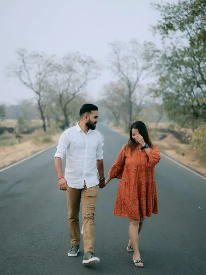A candid, laughing moment as the couple walks down an empty country road. These are the genuine interactions I love to capture.