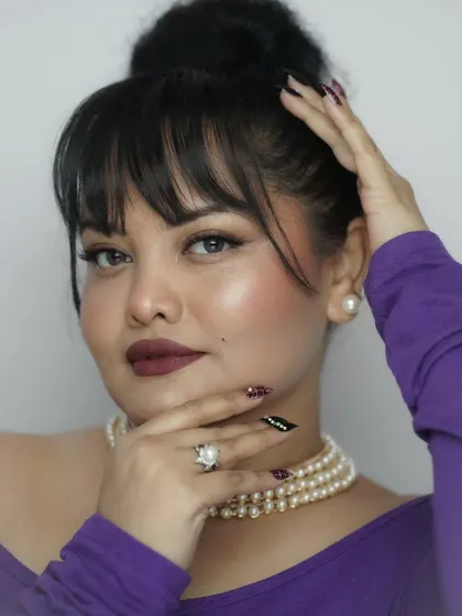A direct, confident gaze. The winged eyeliner is sharp and precise, and the skin has a beautiful, healthy glow. This is the power of investing in your self-worth.