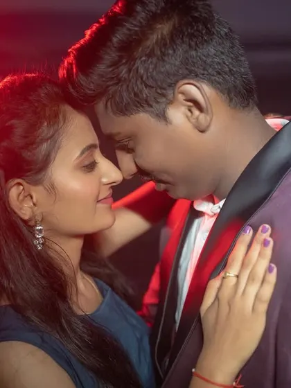 An intense and romantic close-up using dramatic red lighting. This technique adds a bold, cinematic flair to your pre-wedding portraits.