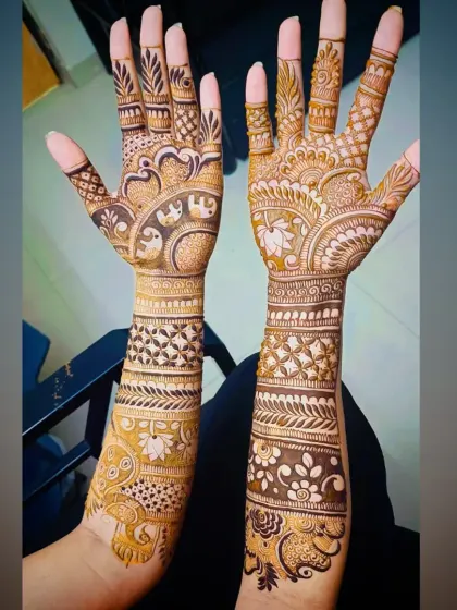 This bridal design includes a procession of elephants on the wrist, a symbol of good luck, strength, and prosperity.