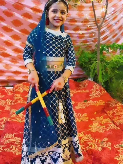 Another look at our student performer in her detailed blue and gold ghagra choli for a festival show.