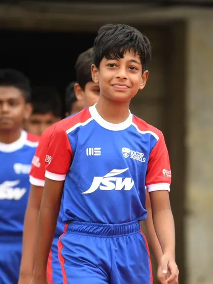 A young player smiles as he walks out of the tunnel, living the dream at the BFC Open House.