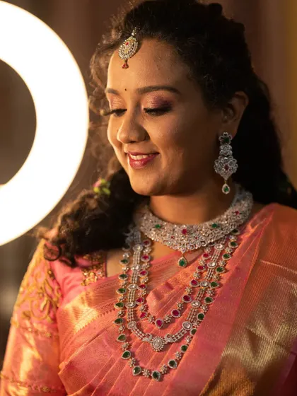 My beautiful client chose this multi-layered AD stone necklace for her reception. It gives the magnificent look of diamond jewellery and was perfect for her peach saree.