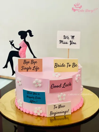 A sweet and simple 'Bride to Be' cake to say 'Bye Bye Single Life'. This pink cake is decorated with messages of good luck and new beginnings for the bride.