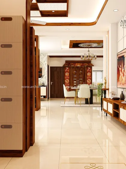 An open-plan layout showing the seamless integration of modern and traditional design. The view flows from the contemporary TV unit to the classic dining area with its ornate pooja doors.
