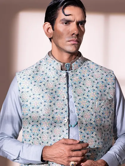 A closer look at the embroidered Nehru jacket, highlighting the intricate threadwork and the custom brooch I added to the collar.