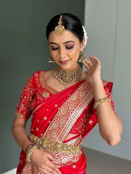 A duplicate image showing a close-up of the jewelry and saree details.