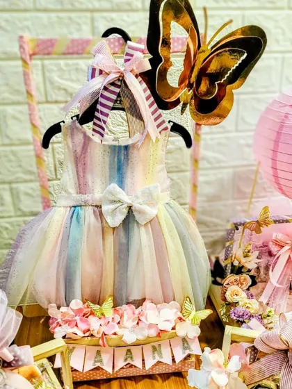 This baby closet hamper for Yaana is one of the cutest things I've made. The little rainbow dress is the star of this beautiful arrangement, perfect for a birth announcement.