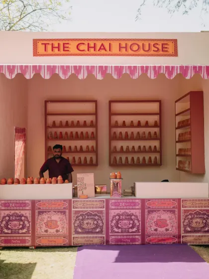 A whimsical "Saturday Market" themed event in Udaipur, with custom-designed stalls for a Chai House, Frozen Yoghurt, and Ice Gola, complete with unique branding and playful decor.