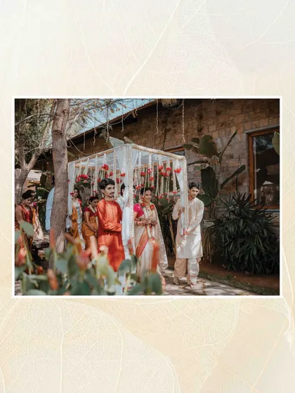 A wide shot of the wedding procession, showing the beautiful outdoor setting and the traditional elements of the ceremony.