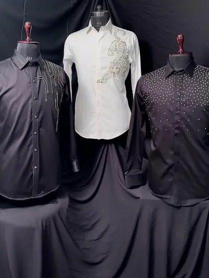 A lineup of three statement shirts: a black shirt with abstract silver embroidery, the white tiger shirt, and the black studded shirt. A trio of bold choices for a night out.