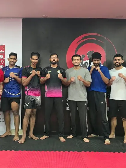 Our morning batch stands ready with their coach. Starting the day with training sets a powerful tone for everything else.