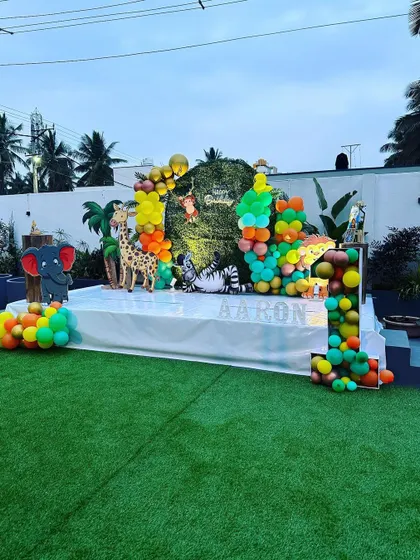 Another angle of the jungle-themed birthday setup, highlighting the stage and decor elements we can help arrange.