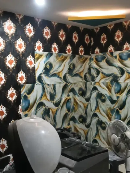The salon interior, showing the damask wallpaper paired with a modern, abstract marble mural.