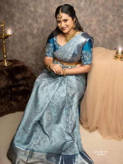 A serene moment captured during the photoshoot. The color of the saree and blouse is so unique and photographs beautifully.