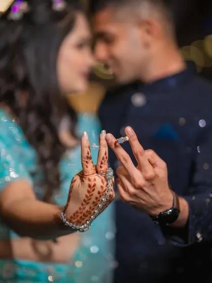 A creative ring shot where Diksha and Vighnesh show off their engagement rings. This playful pose is a great way to announce that you're officially engaged.