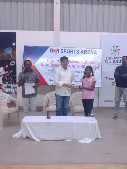 Our students from GMR Sports Arena receiving their awards at the annual Indoor Badminton Tournament.