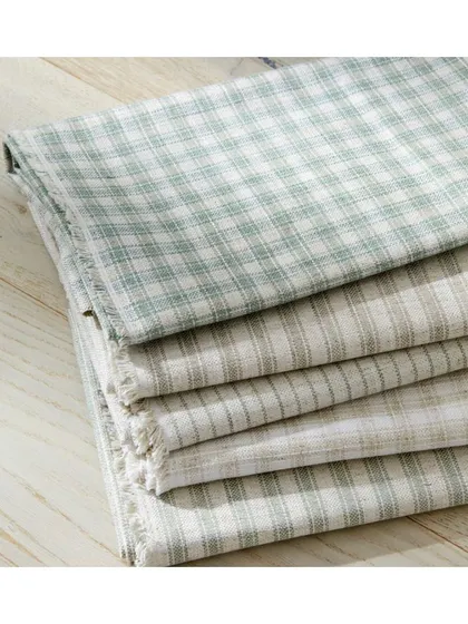 Timeless stripes and chequered patterns in the 'Salford' fabric collection are ideal for creating a classic, understated aesthetic. These are versatile enough for both commercial and residential spaces.